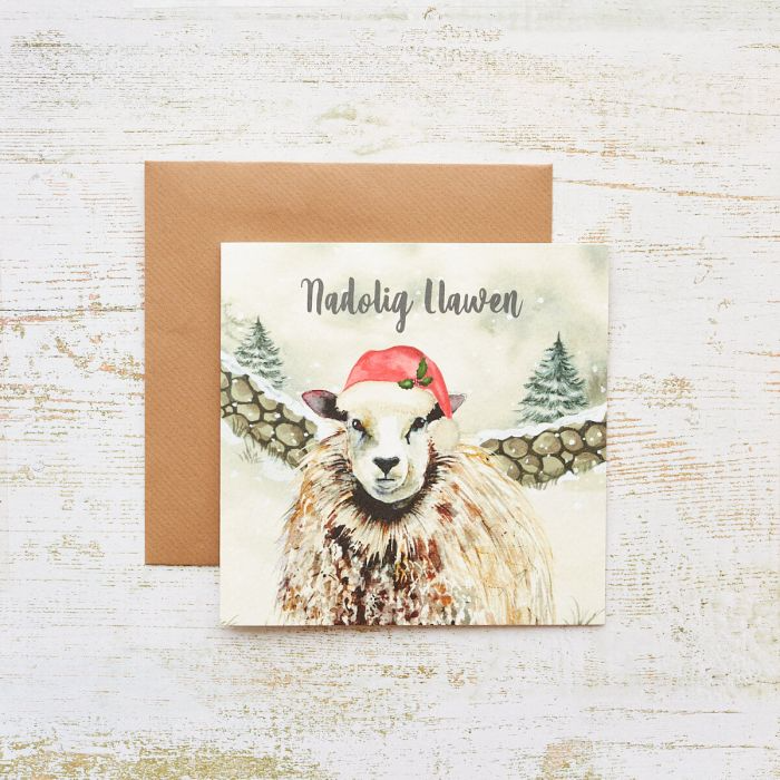 Christmas card 'Nadolig Llawen' snowy sheep